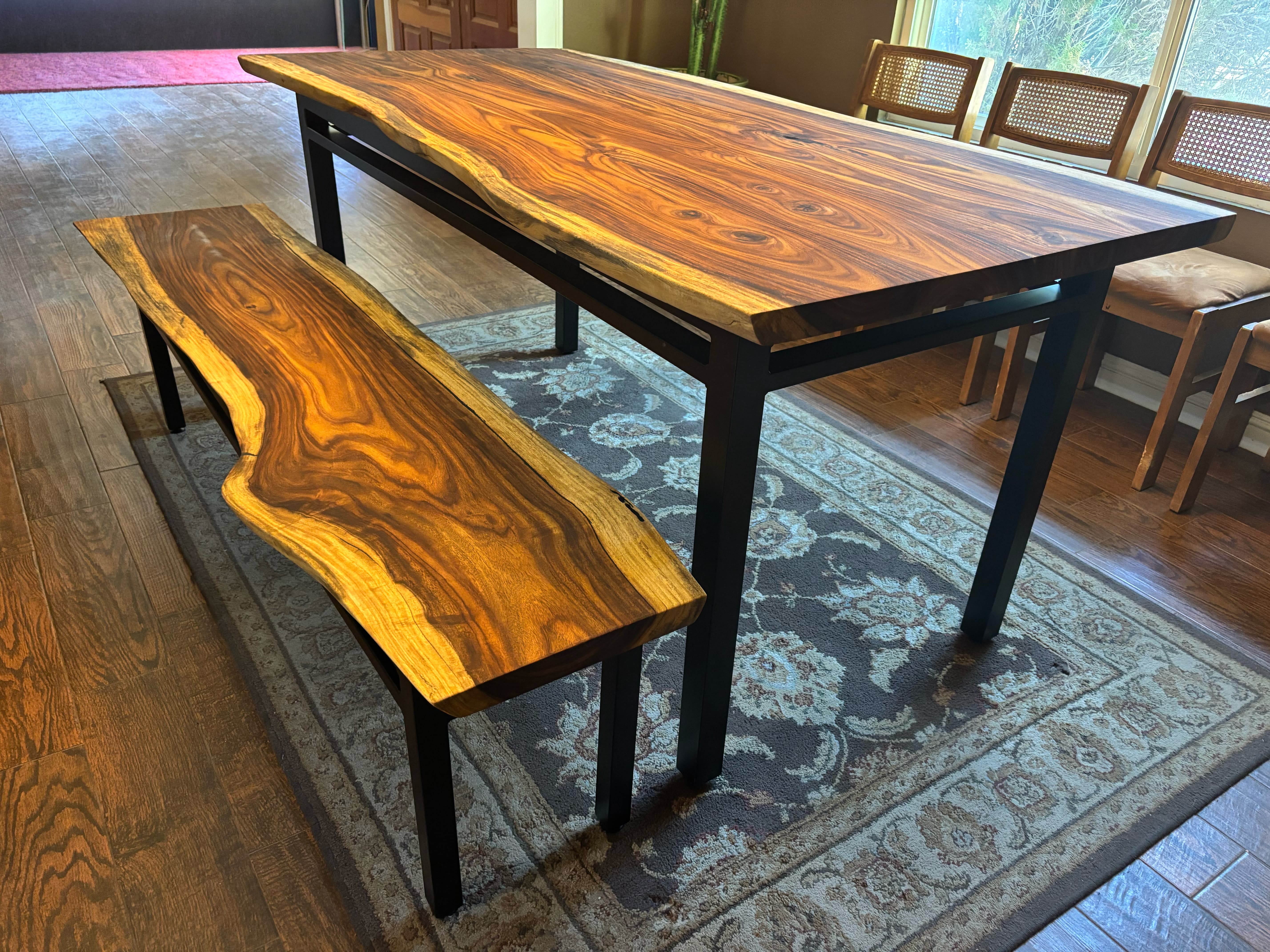 Table and bench together, live edges catching the light