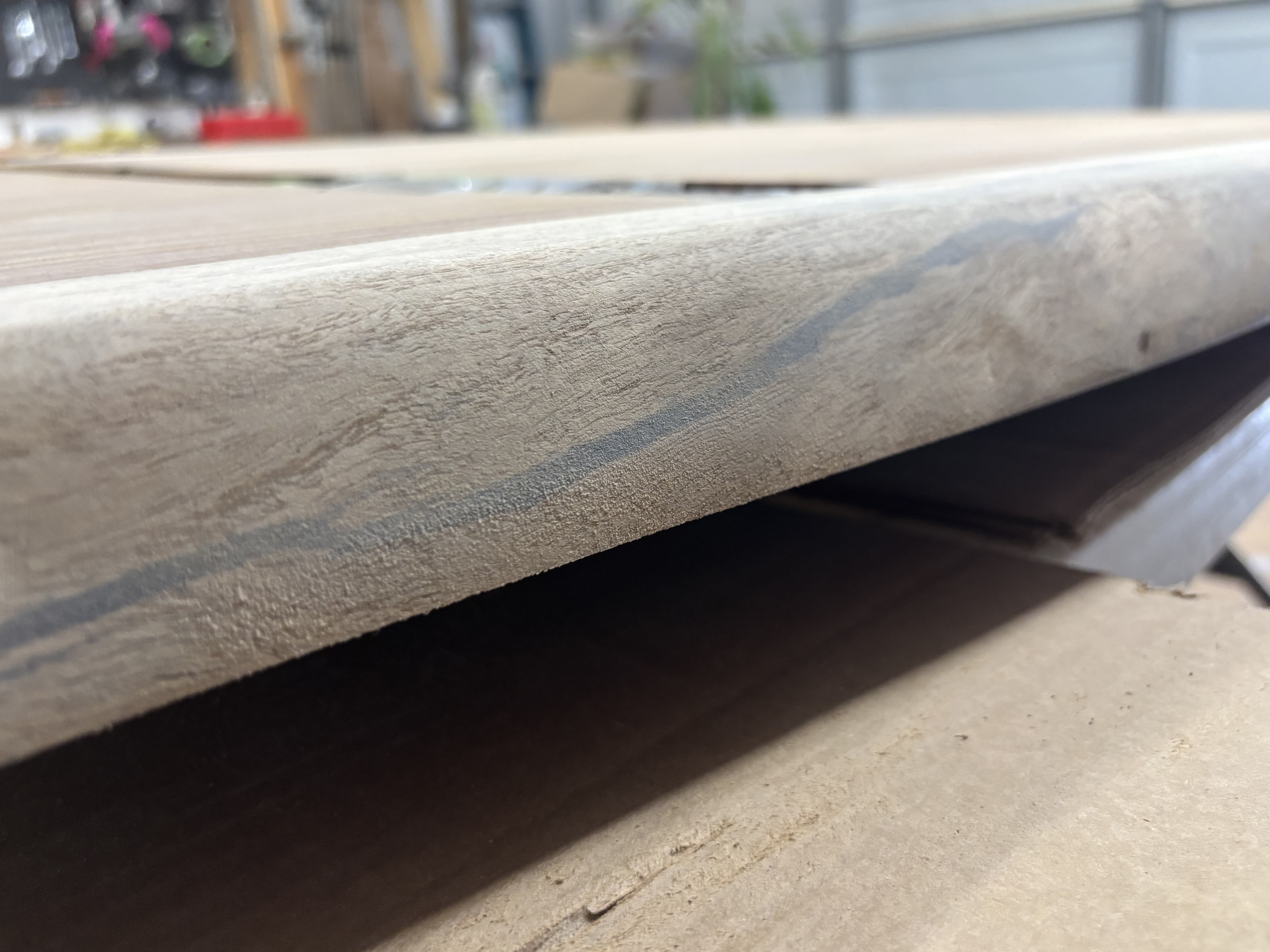 Leveling the epoxy flush with the wood