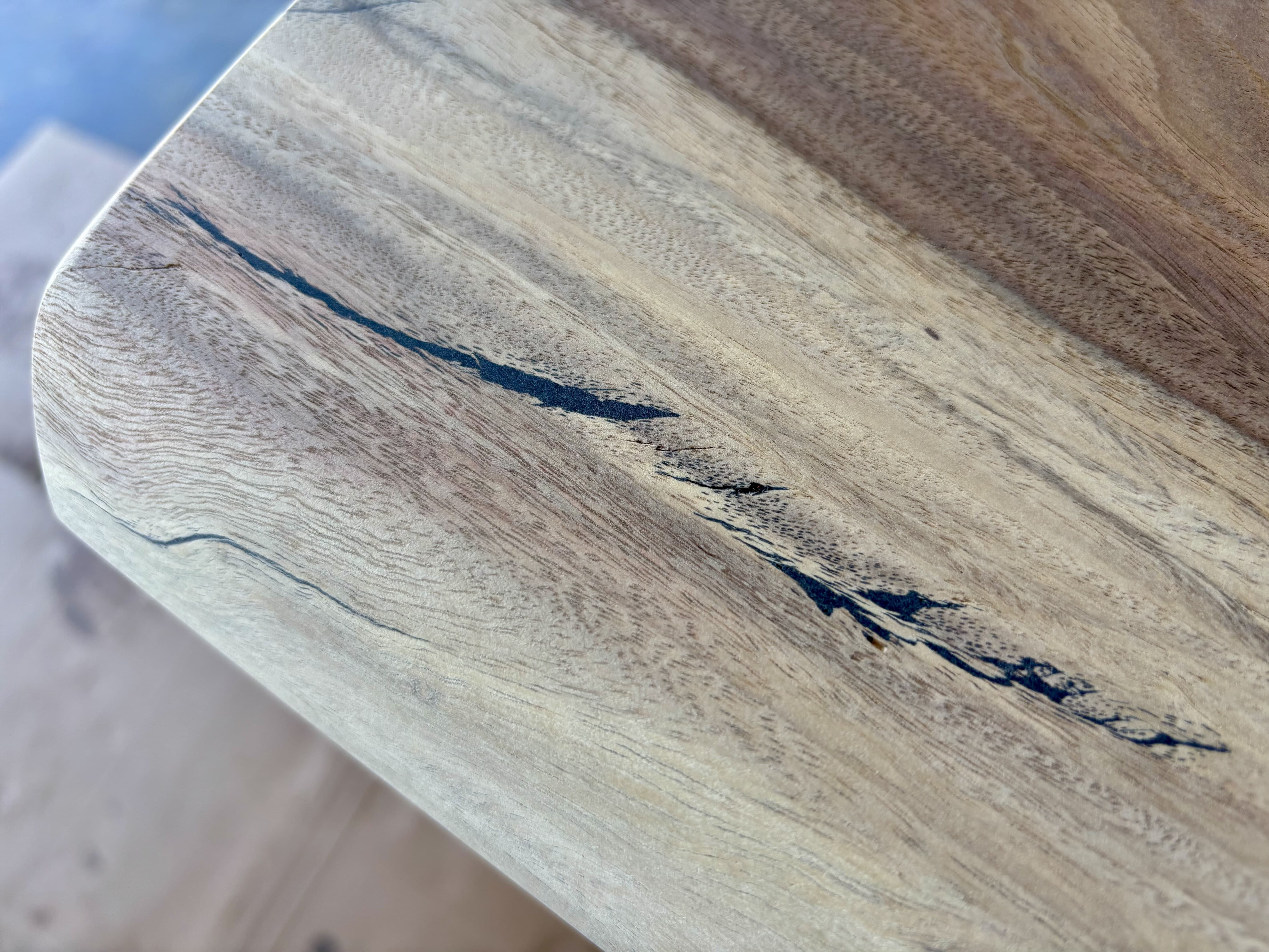 A sanded edge with the black fill leveled flush