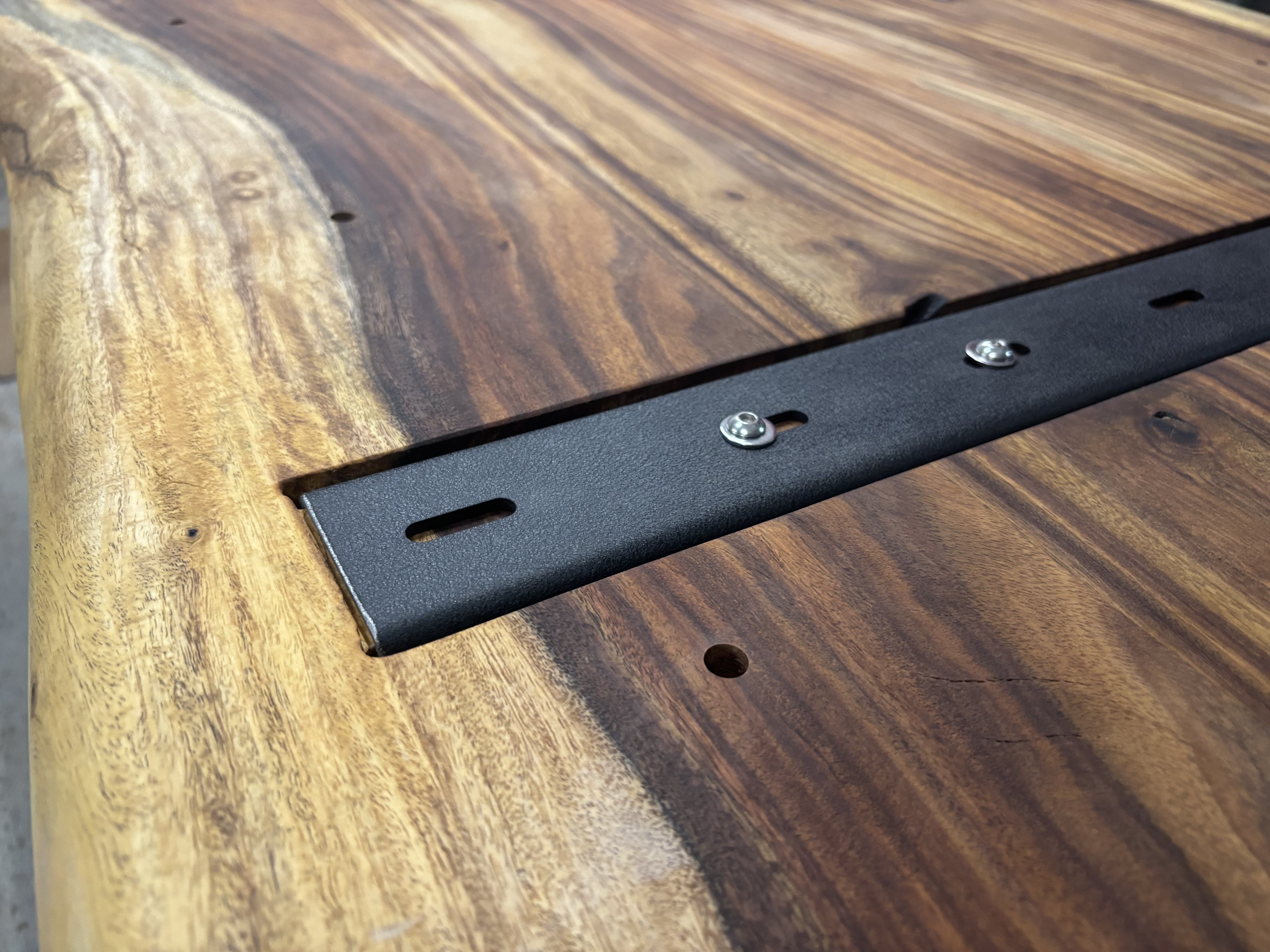 Test-fitting the steel base on the inverted slab