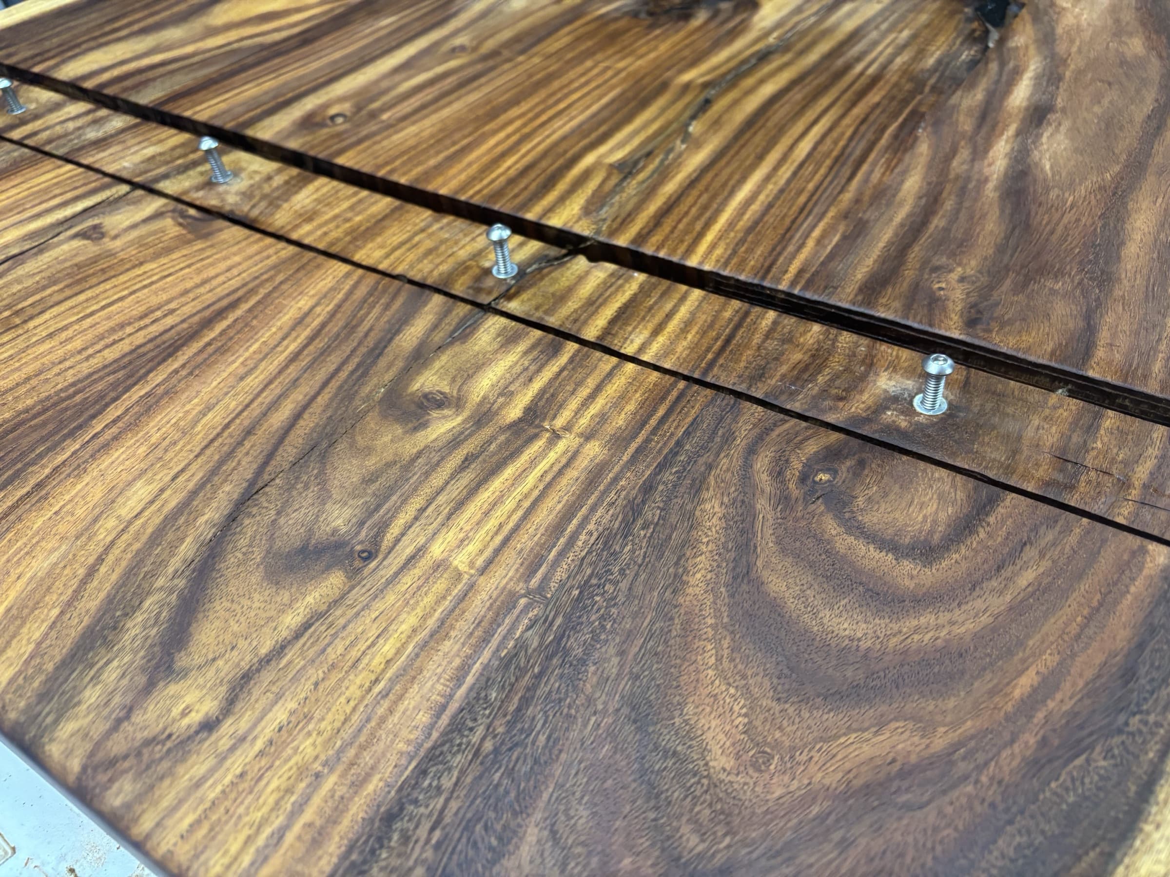 An oiled edge with black CA fills sanded flush